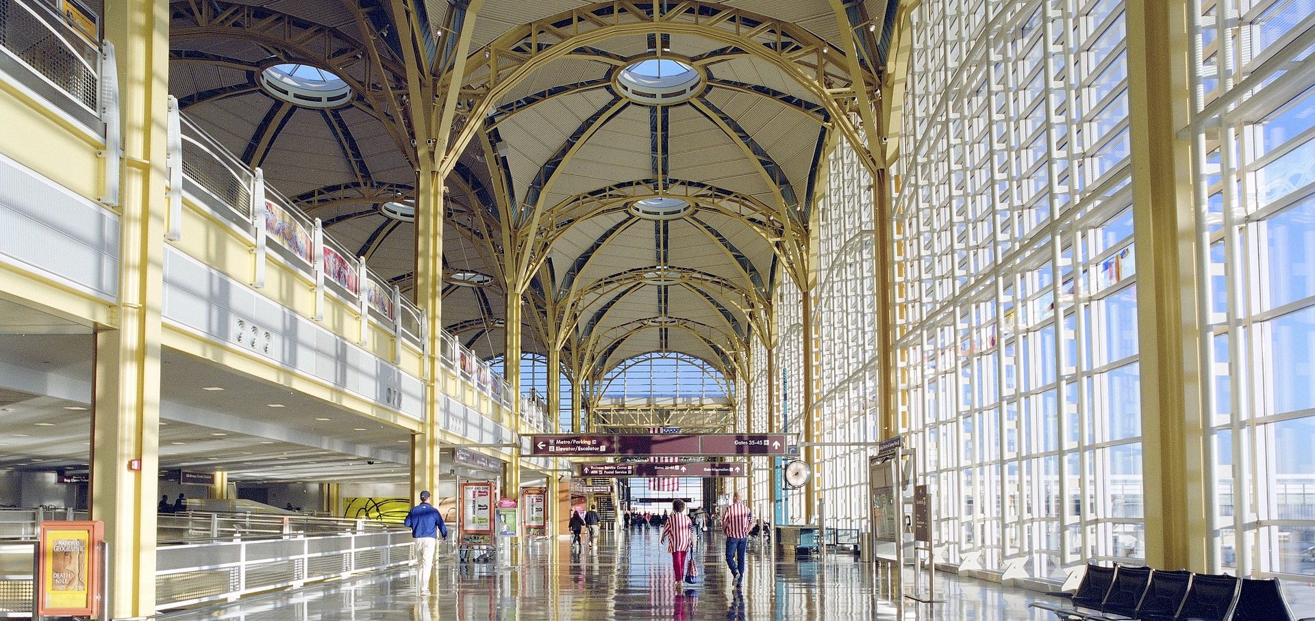 Traveler using airline app to check frequent flyer miles and upgrade options