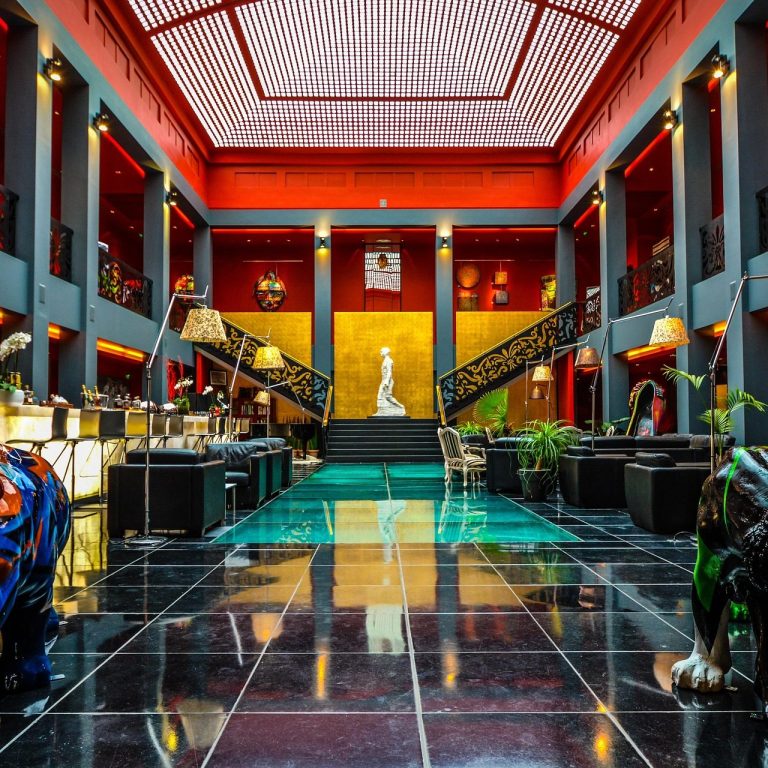 Guest enjoying hotel pool, spa, and modern resort facilities during vacation