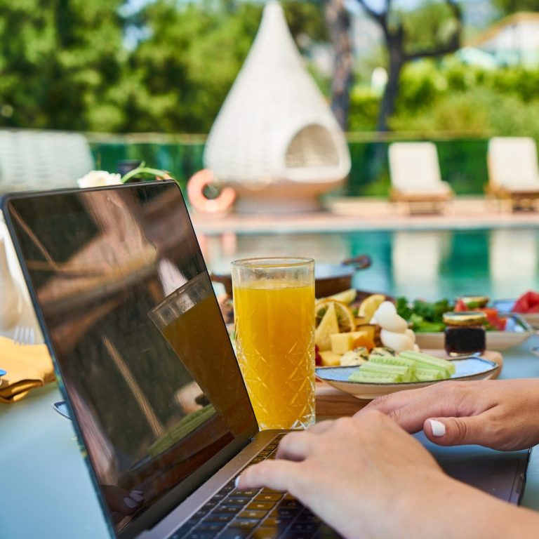 hotel guest on vacation with computer with high-speed Wi-Fi