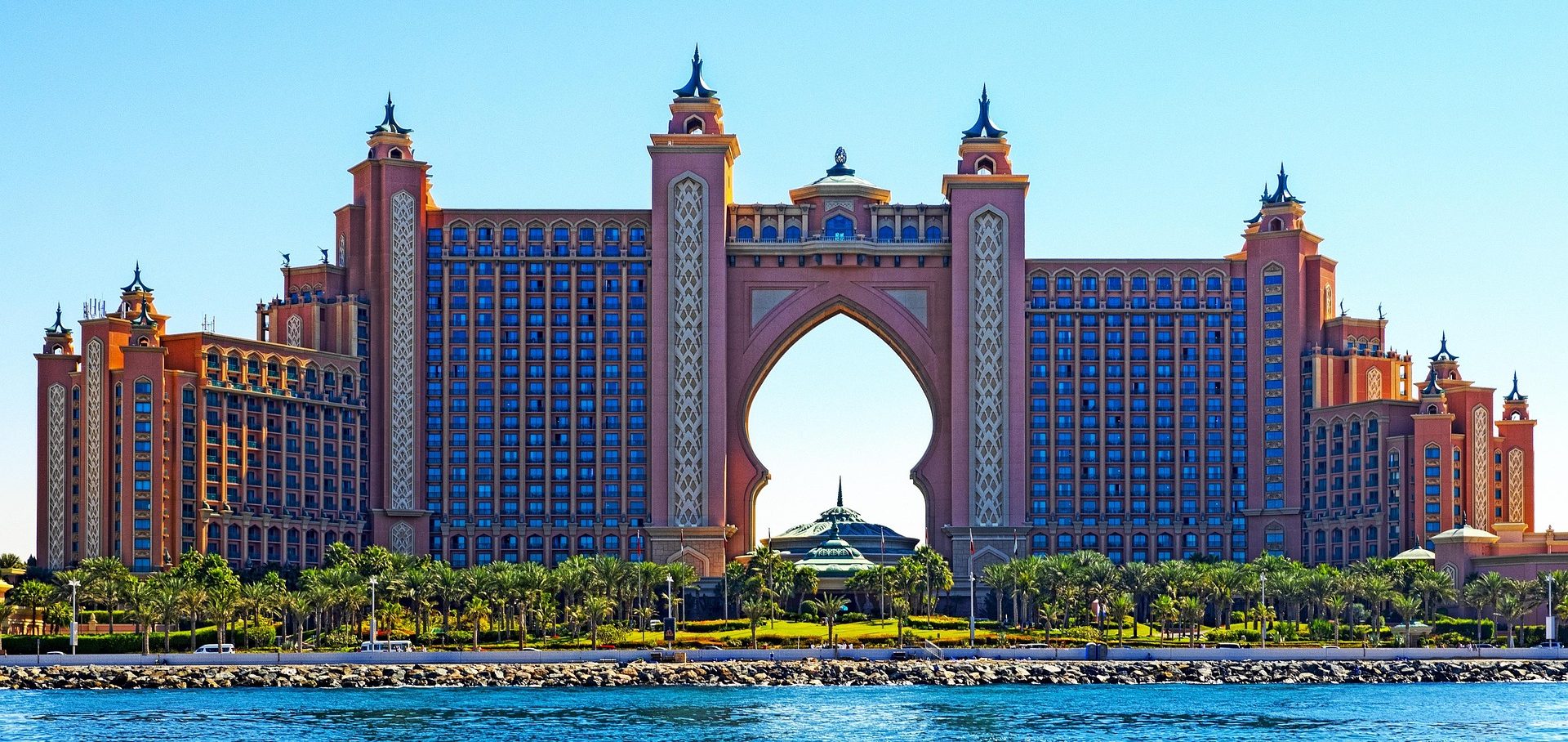 Tourist checking into a stylish hotel lobby using a Holiday Consultant