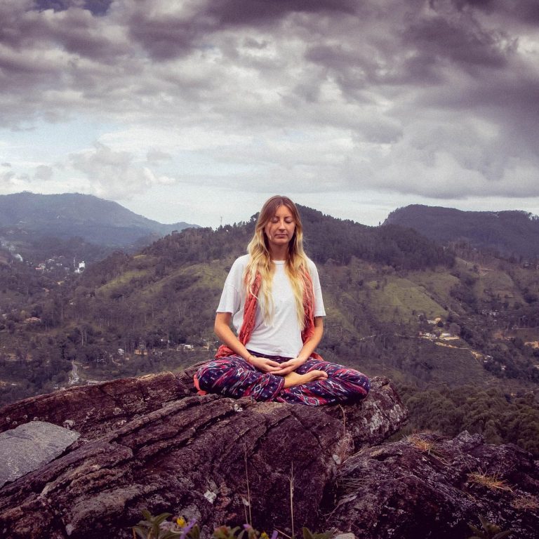 Relaxing wellness vacations to restore balance Wellness traveler meditating outdoors on a retreat