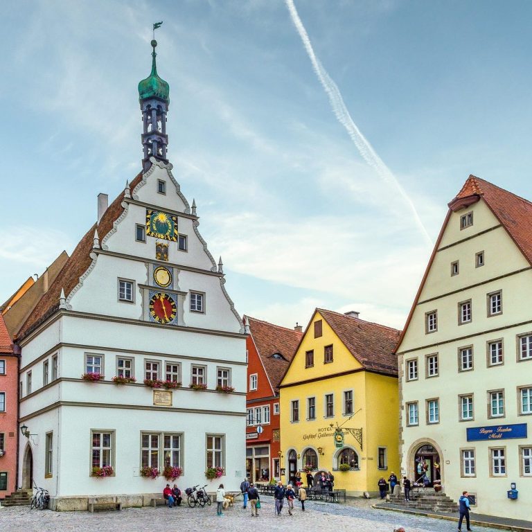Immersive cultural vacations for curious explorers Cultural traveler exploring historic European town square